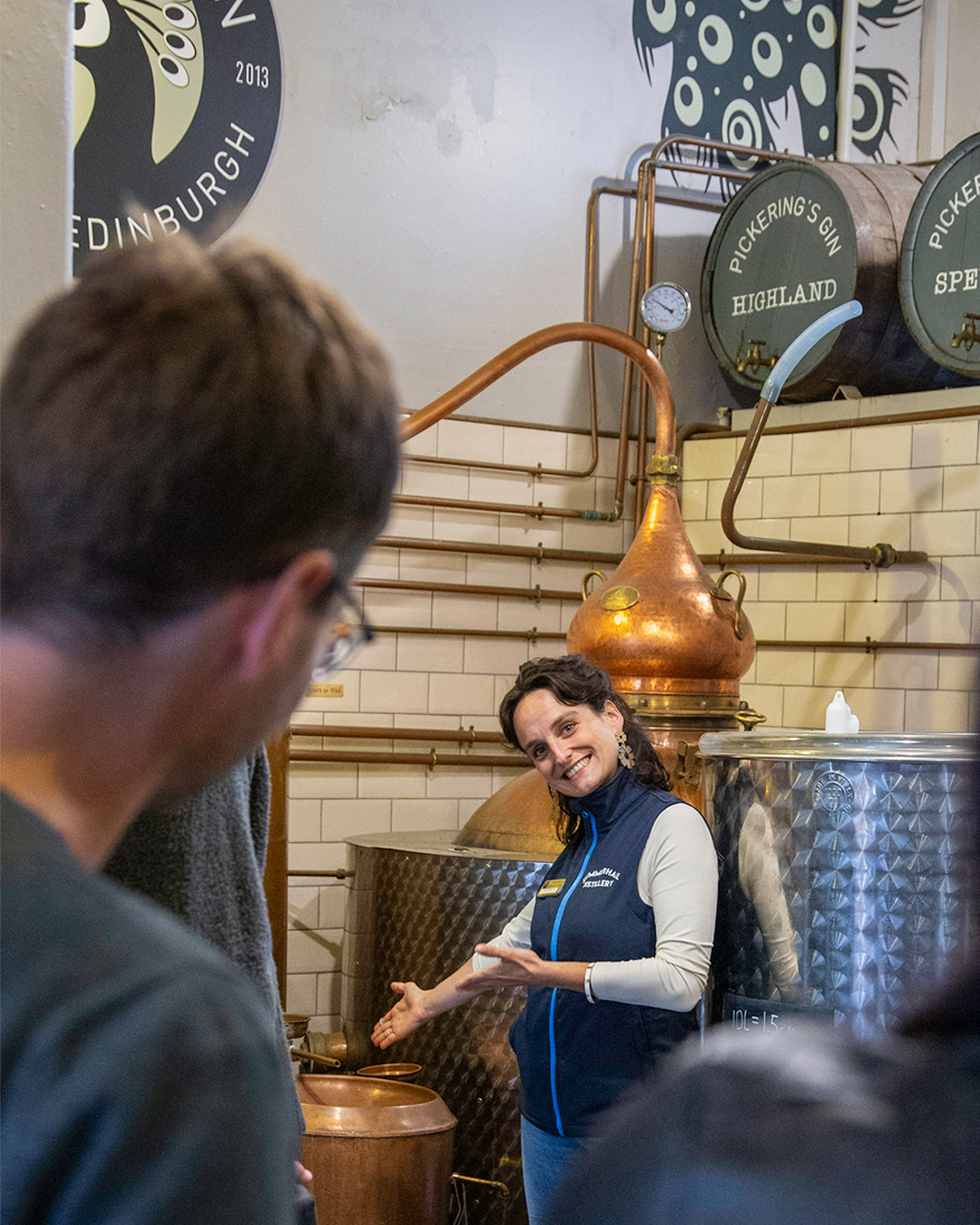 Tour guide pointing at stills